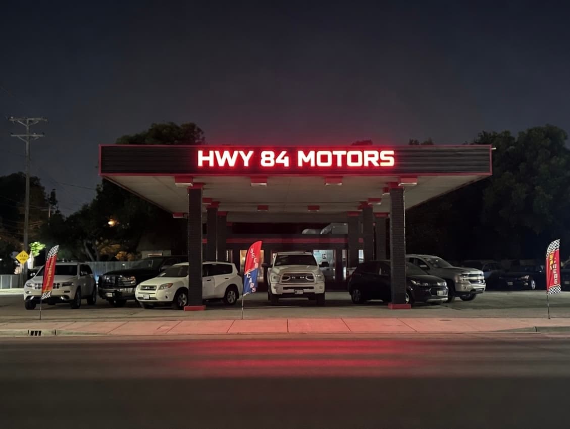 Hwy 84 Motors - Abilene location on S 1st Street with lighted sign at night